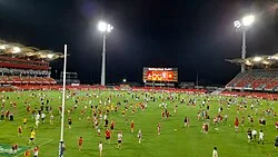Fans allowed on the field following the completion of the Gold Coast vs Sydney match in 2023