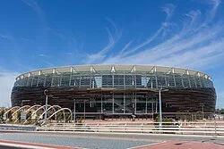 Exterior view of the stadium in December 2017, its stylistic brown facade visible