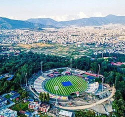 Aerial view of the stadium in 2025 with Kathmandu Valley in backdrop