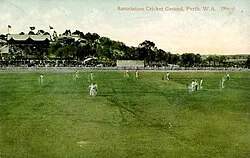 An early coloured image of the Association ground in about 1910, looking north, with a large crowd watching a game in progress. Note the original 1890s stand is evidently packed.